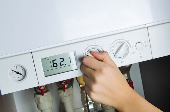 A plumper testing a boiler